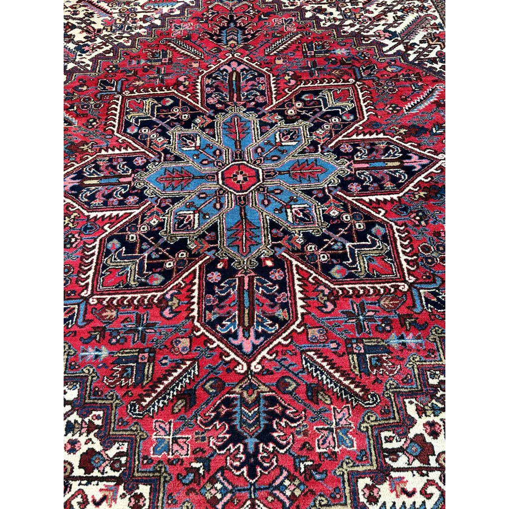 Vibrant red Persian Heriz rug with geometric medallion design