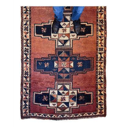 Stunning Persian Luri tribal runner rug in rust-red with navy and cream geometrics