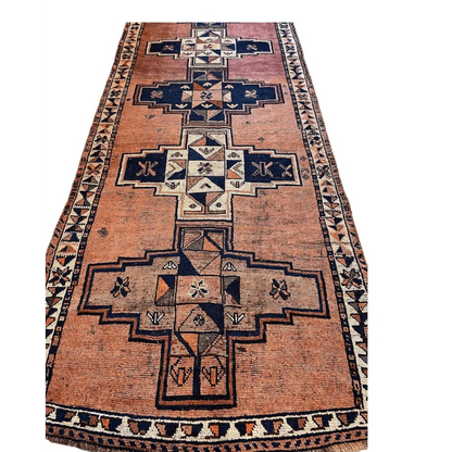 Vintage Persian Luri tribal runner rug with navy geometric cross on orange wool field