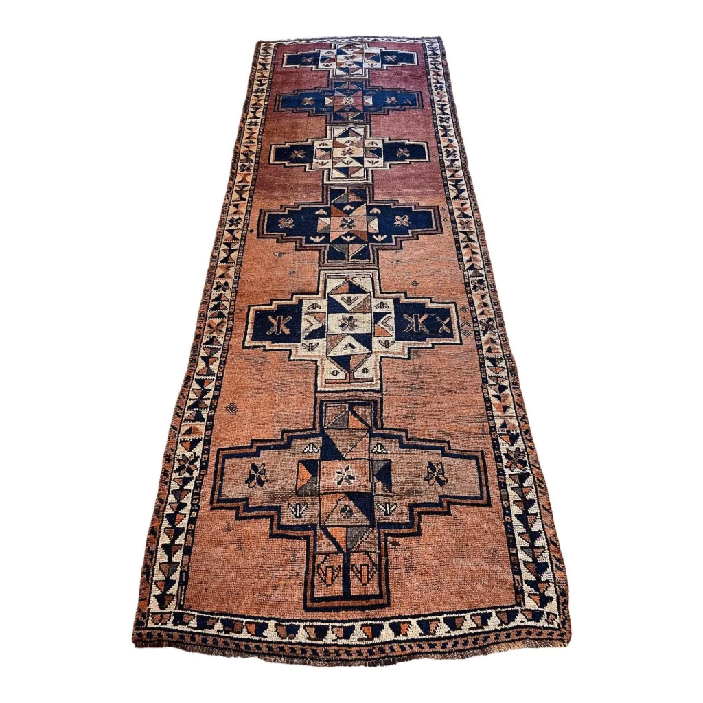 Vintage Persian Luri tribal runner rug with bold geometric patterns in orange, red, navy and cream
