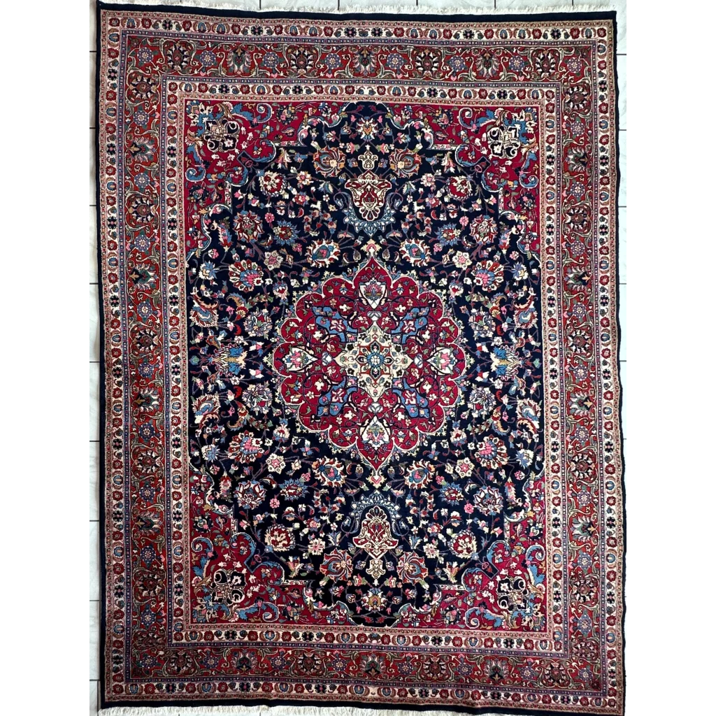 Stunning Persian Mashhad hand knotted wool area rug with navy blue field