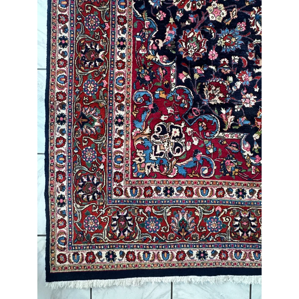 Stunning Persian Mashhad hand knotted wool area rug with red navy floral motifs