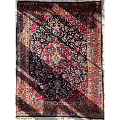 Stunning Persian Mashhad hand knotted wool area rug with red navy medallion