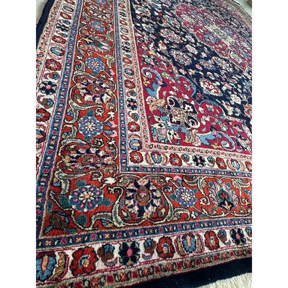 Stunning Persian Mashhad hand knotted wool area rug with intricate floral patterns