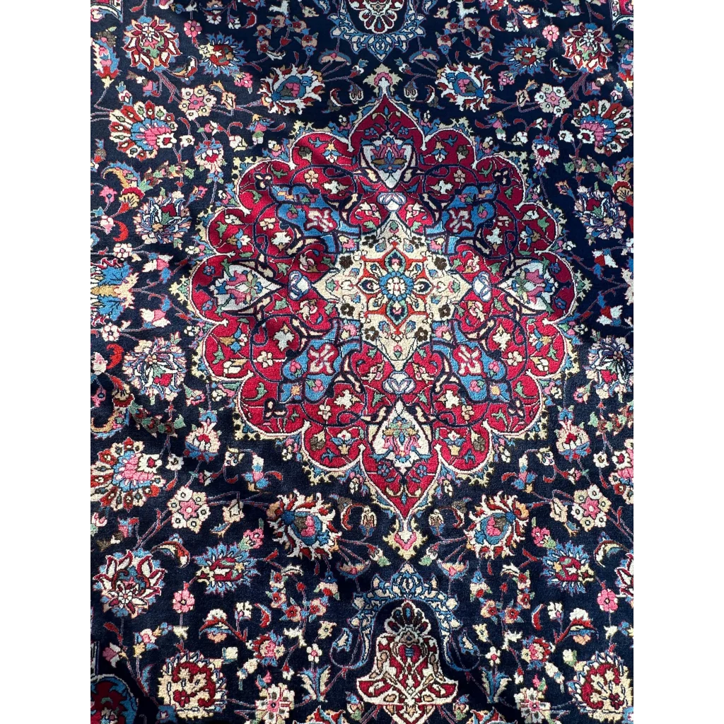 Stunning Persian Mashhad hand knotted wool area rug with red blue medallion