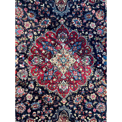 Stunning Persian Mashhad hand knotted wool area rug with central red medallion