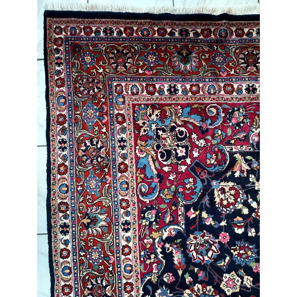 Stunning Persian Mashhad hand knotted wool area rug with intricate floral motifs