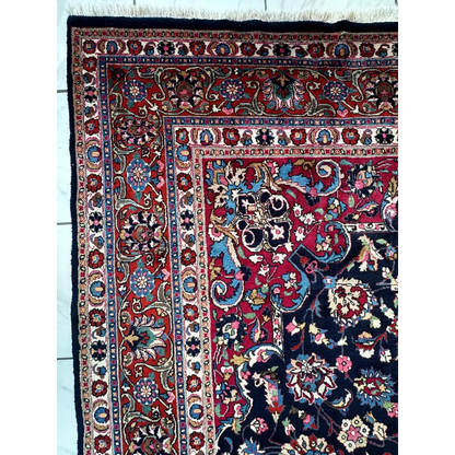 Stunning Persian Mashhad hand knotted wool area rug with intricate floral motifs