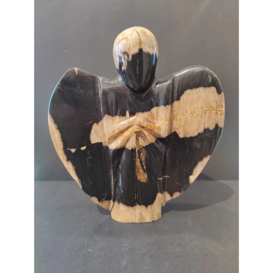 Stunning petrified wood angel figurine in black and cream stripes