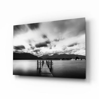 Stunning wooden pier glass wall art with moody skies and mountains