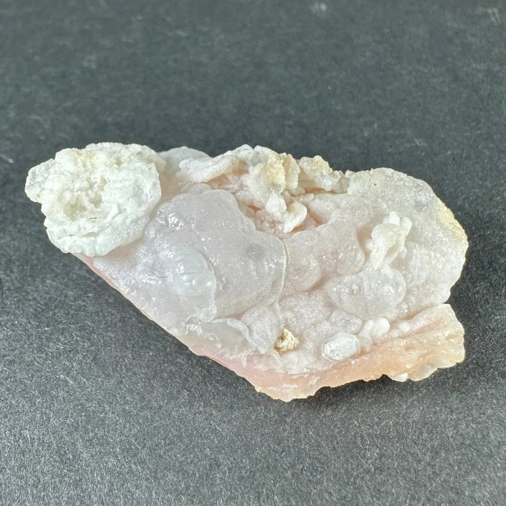 Stunning pink opal Ica geode with translucent pink quartz and white crystals