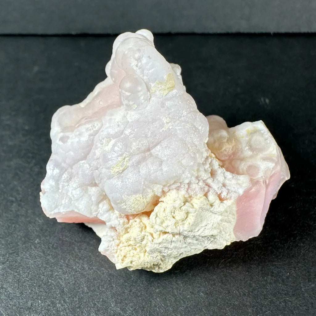 Stunning pink opal Ica geode with translucent pink and white crystalline layers