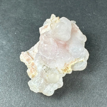 Stunning pink opal Ica geode with translucent crystalline layers