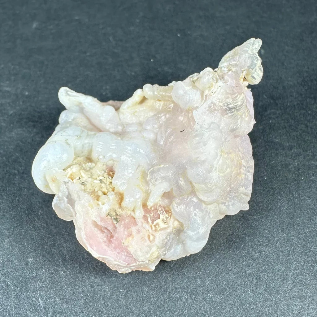 Stunning pink opal Ica geode with translucent pink and white crystalline layers
