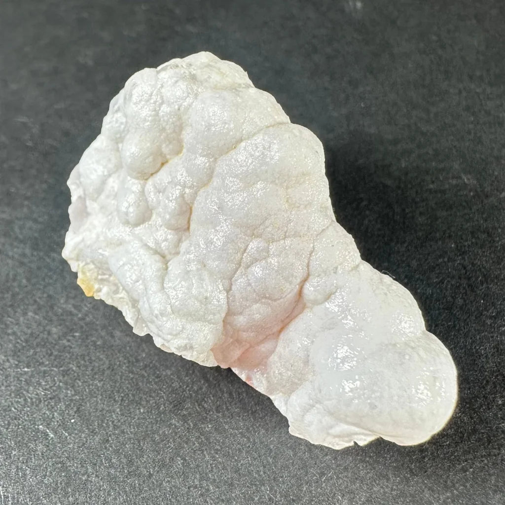 Stunning pink opal Ica geode with white textured, translucent layers