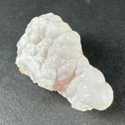 Stunning pink opal Ica geode with white textured, translucent layers