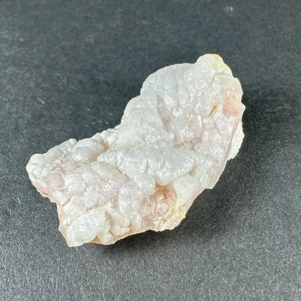 Stunning pink opal Ica geode with translucent pale pink and white crystalline layers