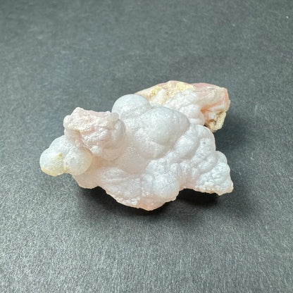 Stunning pink opal Ica geode with translucent pink and white crystalline layers