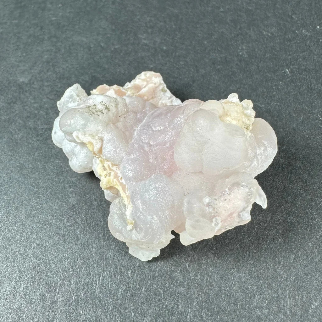 Stunning pink opal Ica geode with translucent bubbly layers
