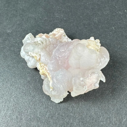 Stunning pink opal Ica geode with translucent bubbly layers