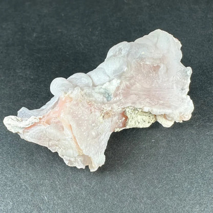 Stunning pink opal Ica geode with translucent pink-white crystalline layers