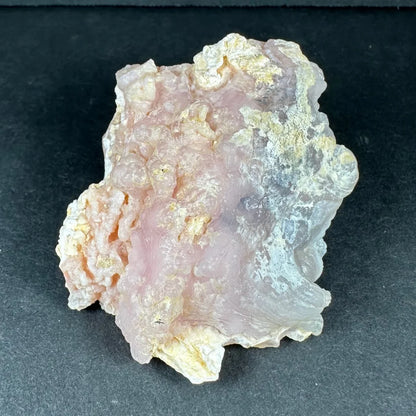 Stunning pink opal Ica geode with translucent pink layers and golden inclusions