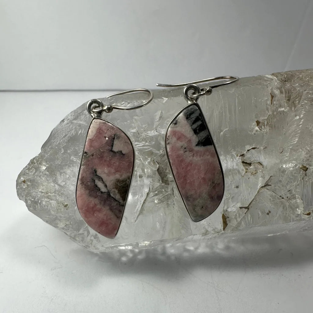 Stunning pink rhodonite earrings with black accents and silver hooks