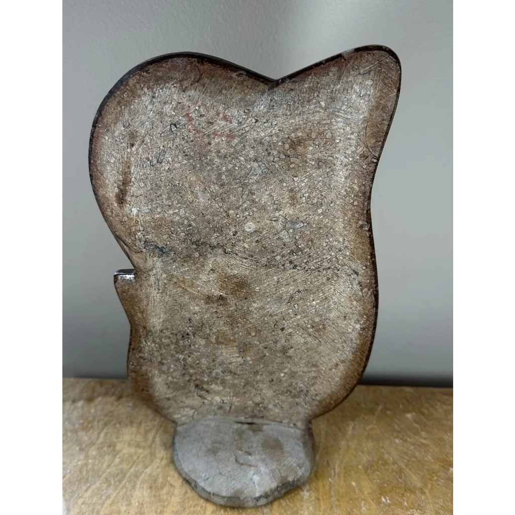 Rustic metallic owl cookie cutter on Moroccan ammonite fossils matrix sculpture