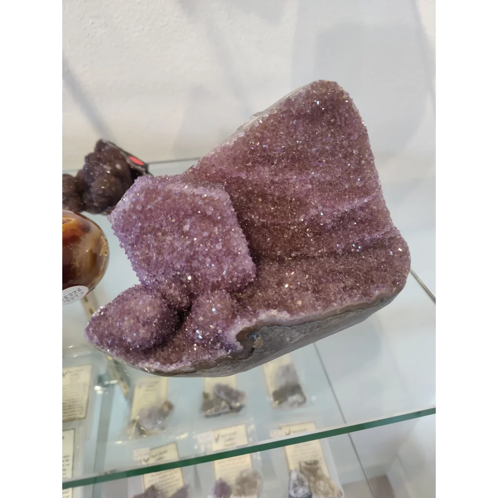 Stunning purple amethyst geode sculpture with glittering crystals