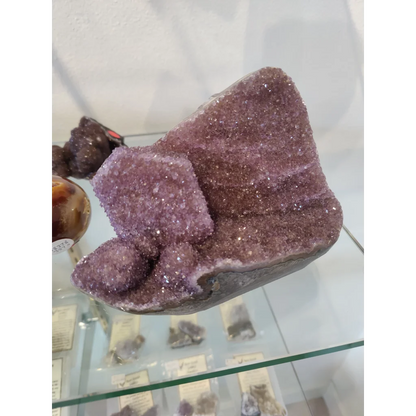 Stunning purple amethyst geode sculpture with glittering crystals
