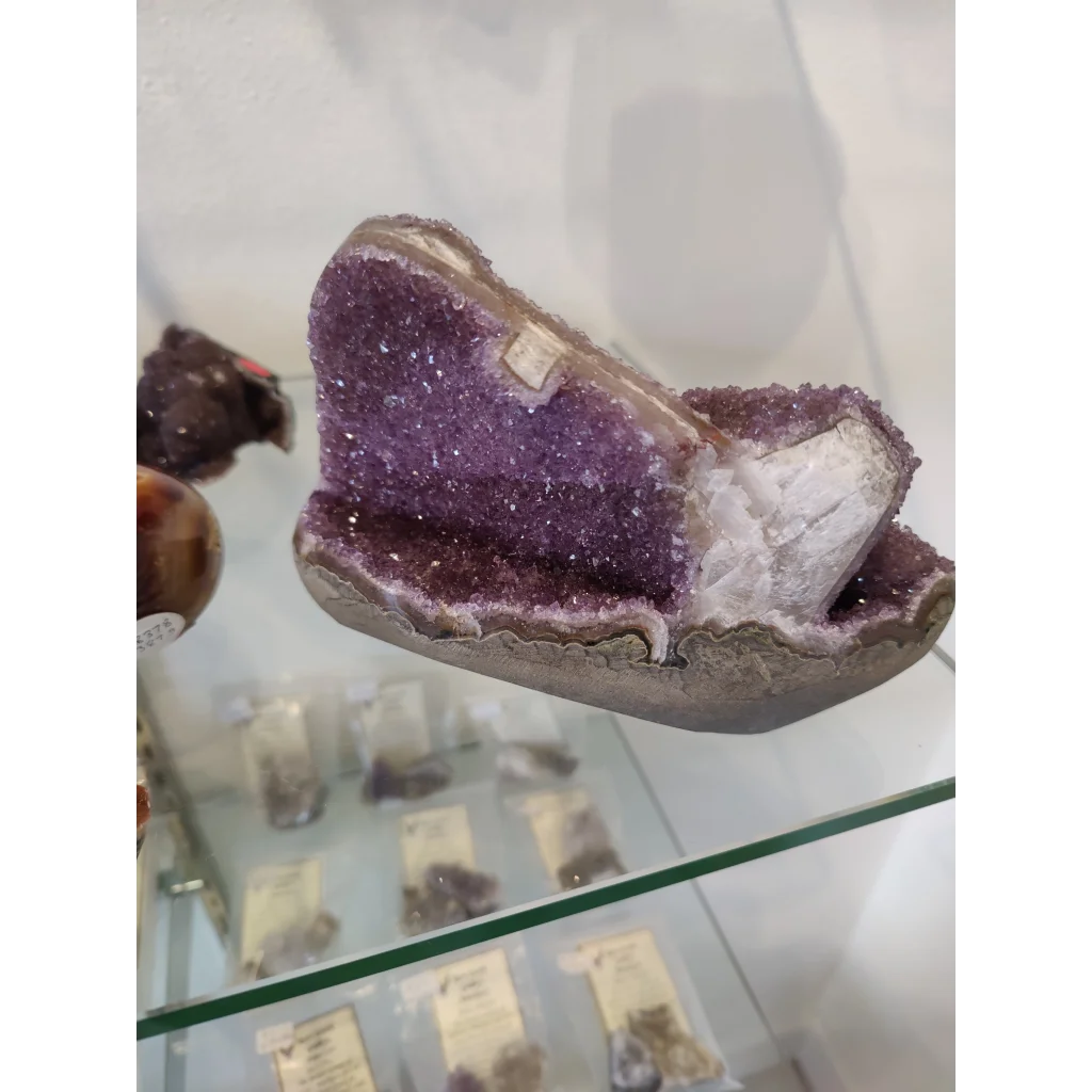 Stunning purple amethyst geode sculpture with sparkling crystals