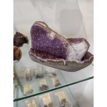 Stunning purple amethyst geode sculpture with sparkling crystals