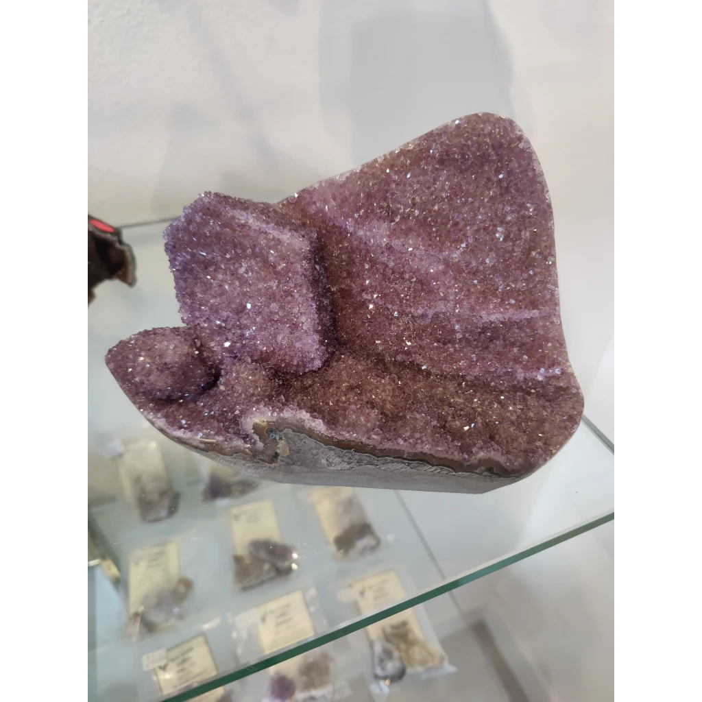 Stunning purple amethyst geode sculpture with sparkling crystals