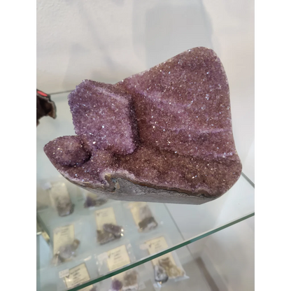 Stunning purple amethyst geode sculpture with sparkling crystals