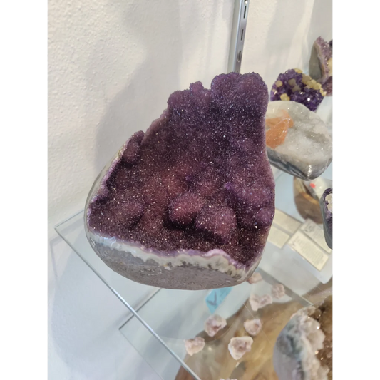Stunning purple amethyst geode sculpture with sparkling crystals