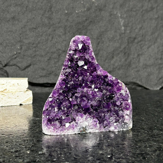 Stunning purple amethyst geode from Uruguay with sparkling triangular crystals