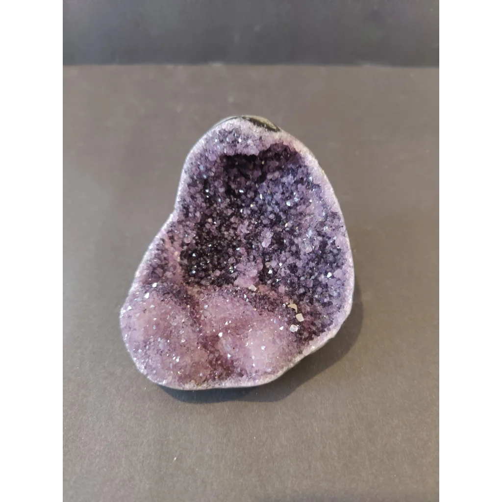 Stunning purple amethyst geode sculpture with calcite crystal inclusions from Brazil