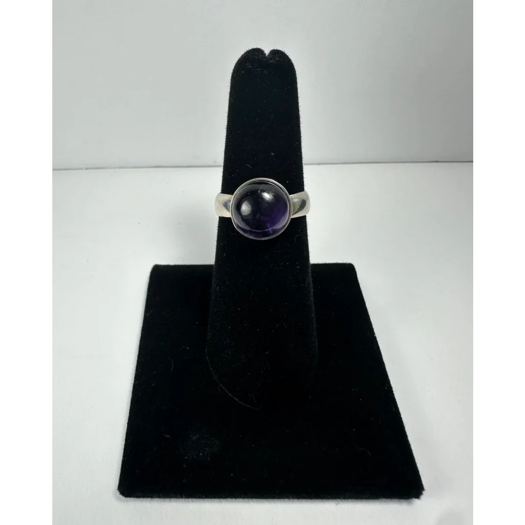 Stunning purple amethyst ring in polished silver with round gem