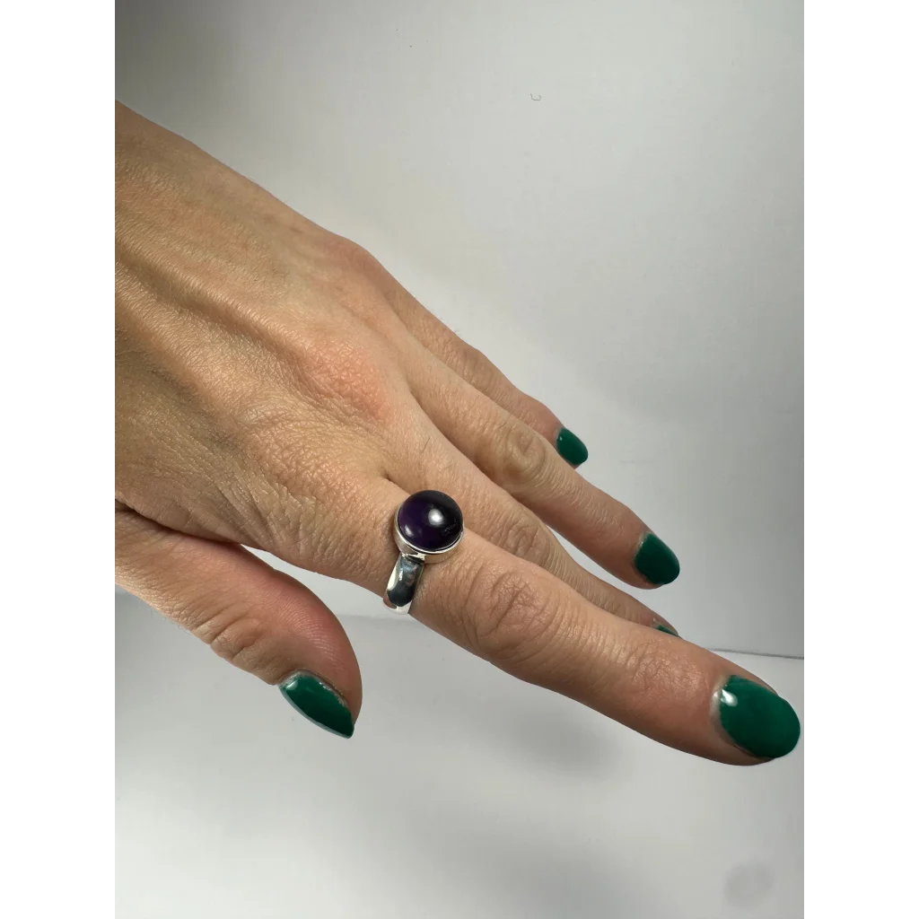Sleek silver amethyst ring with smooth purple stone in minimalist band