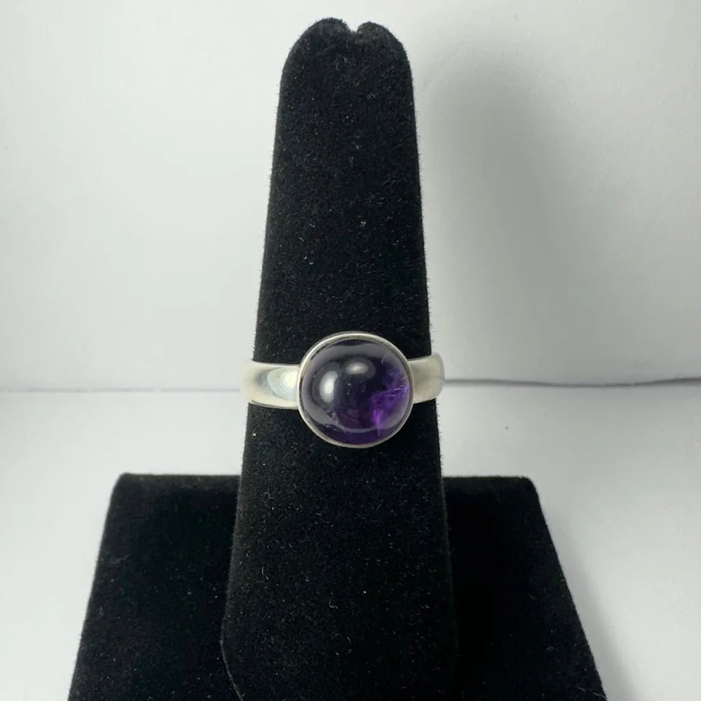 Sleek silver amethyst ring with deep purple bezel-set gem
