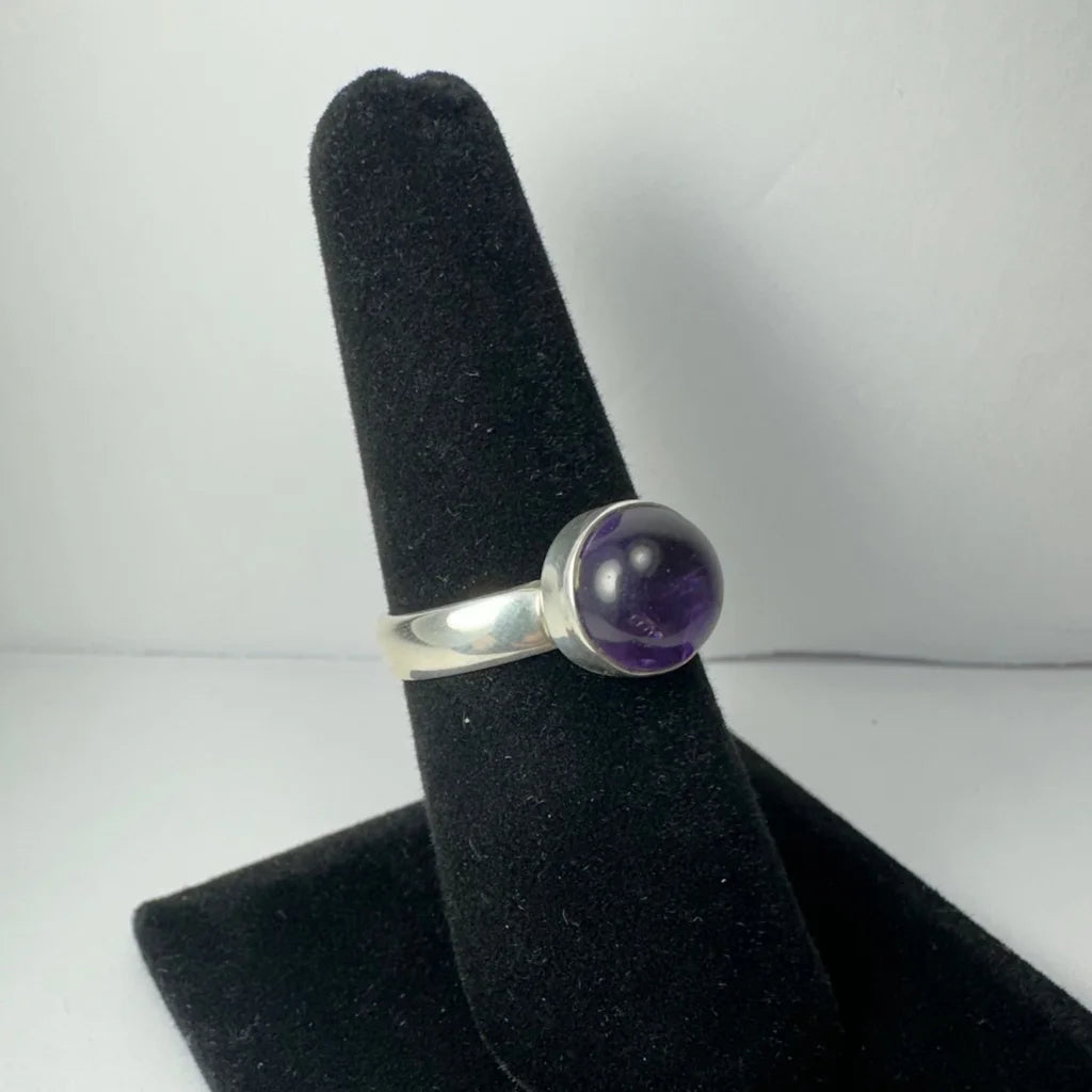 Sleek silver amethyst ring with deep purple bezel-set stone