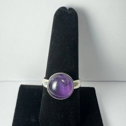 Stunning purple amethyst ring in sleek silver bezel setting