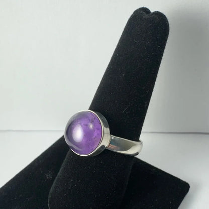 Sleek silver amethyst ring with faceted purple stone in bezel setting