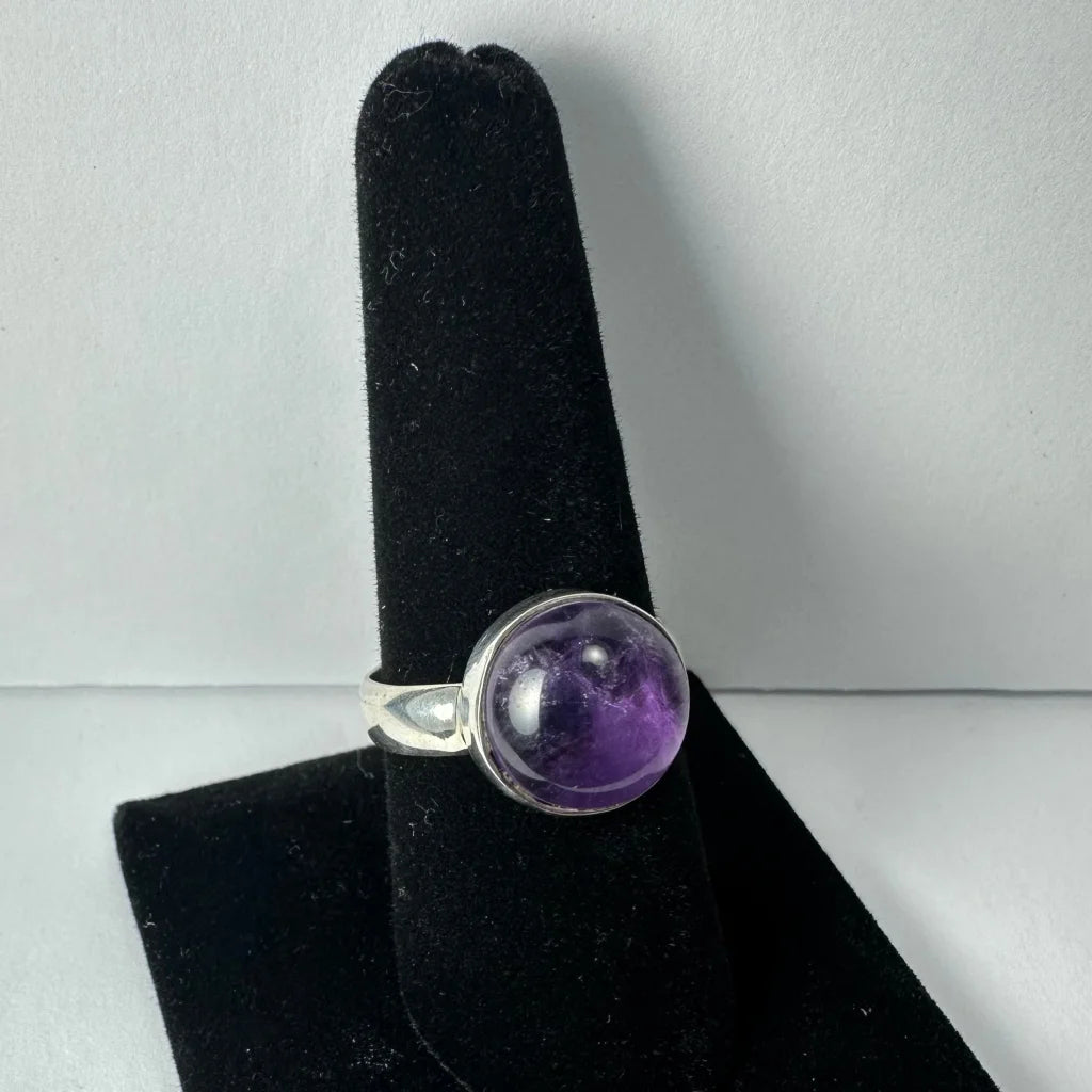Stunning purple amethyst ring in sleek silver bezel setting