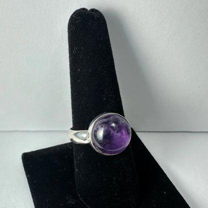 Stunning purple amethyst ring in sleek silver bezel setting