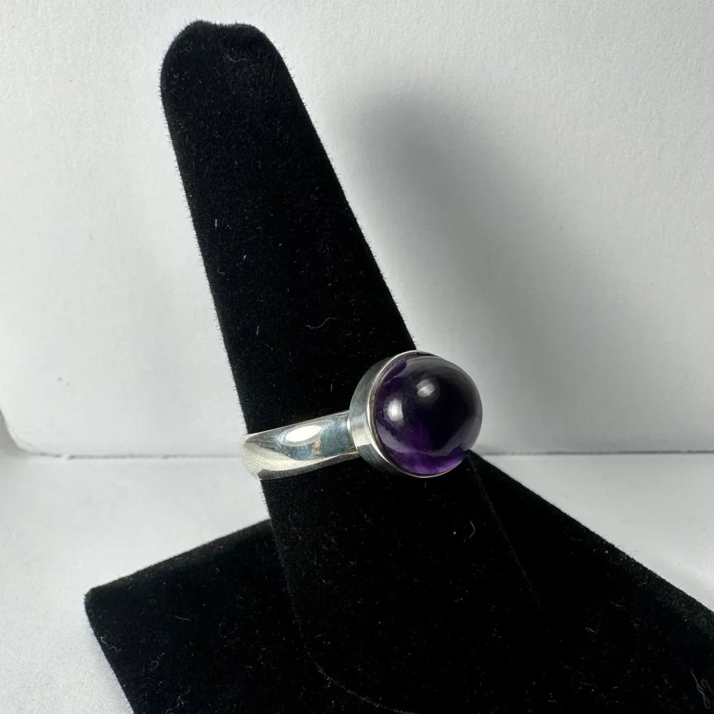Sleek silver amethyst ring with deep purple spherical stone