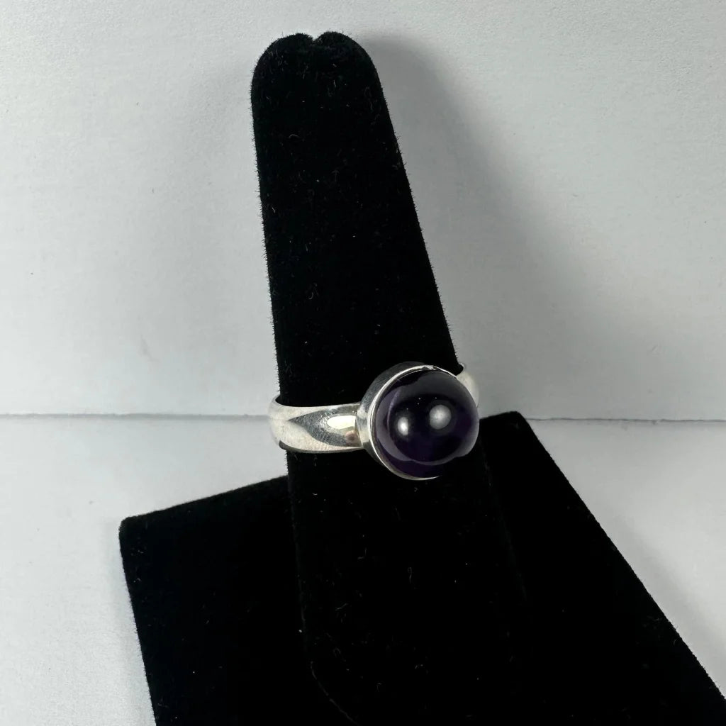 Sleek silver amethyst ring with deep purple cabochon stone