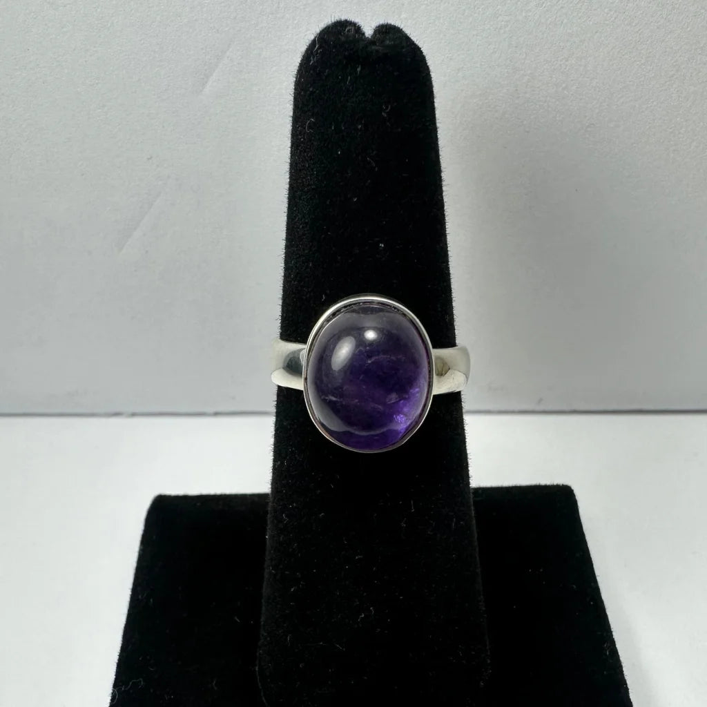 Sleek silver amethyst ring with oval purple stone
