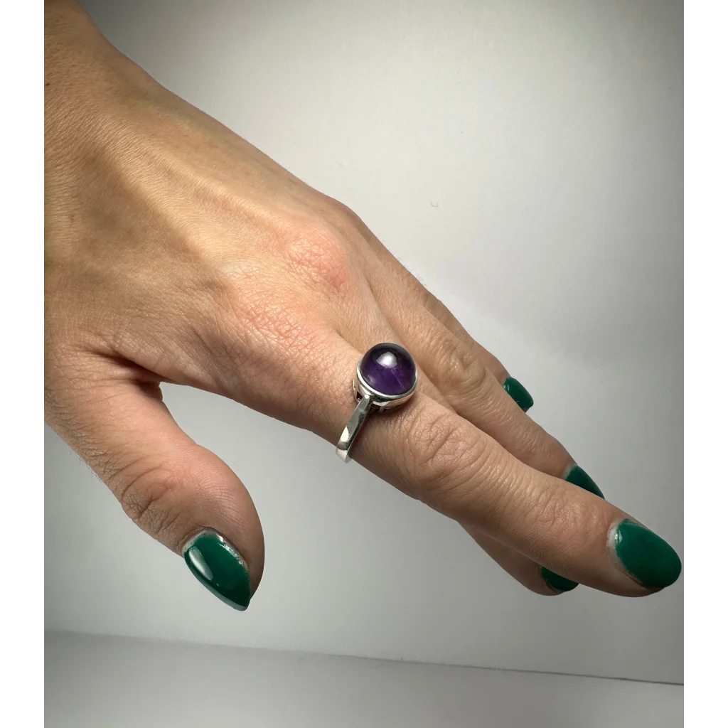 Sleek silver amethyst ring with round deep purple stone in bezel