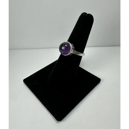 Sleek silver amethyst ring with deep purple round stone in bezel